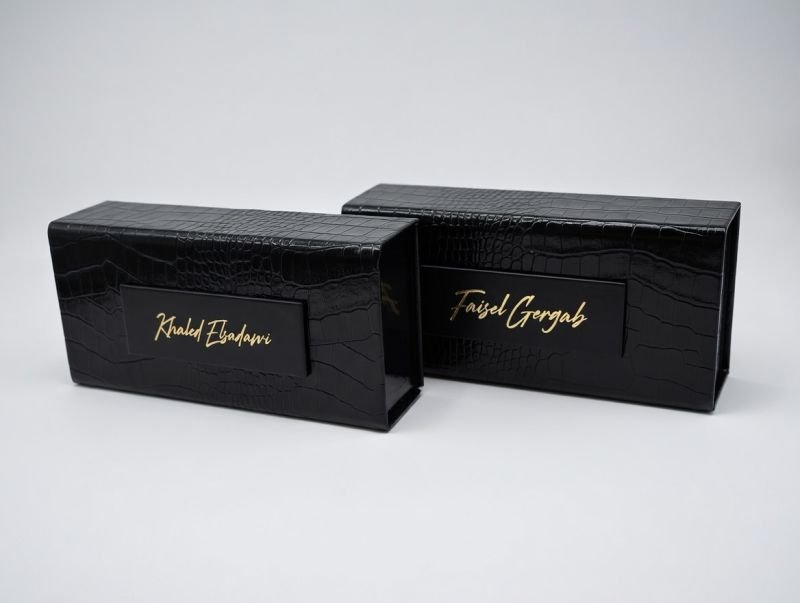 Black croc-embossed leather gift boxes with embossed names