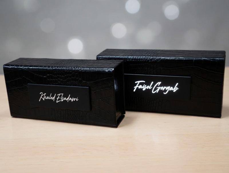 Black croc-embossed leather gift boxes with embossed names