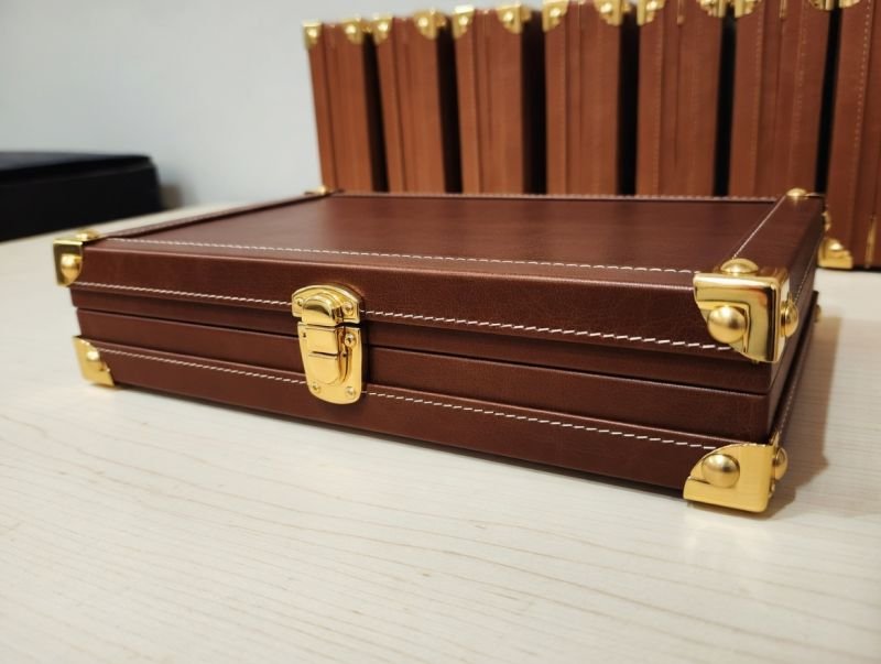 Open tan leather welcome presentation case