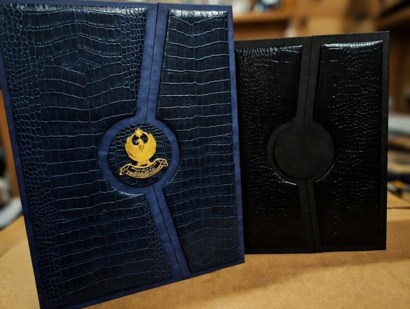 Navy croc-embossed leather portfolio with gold metal emblem
