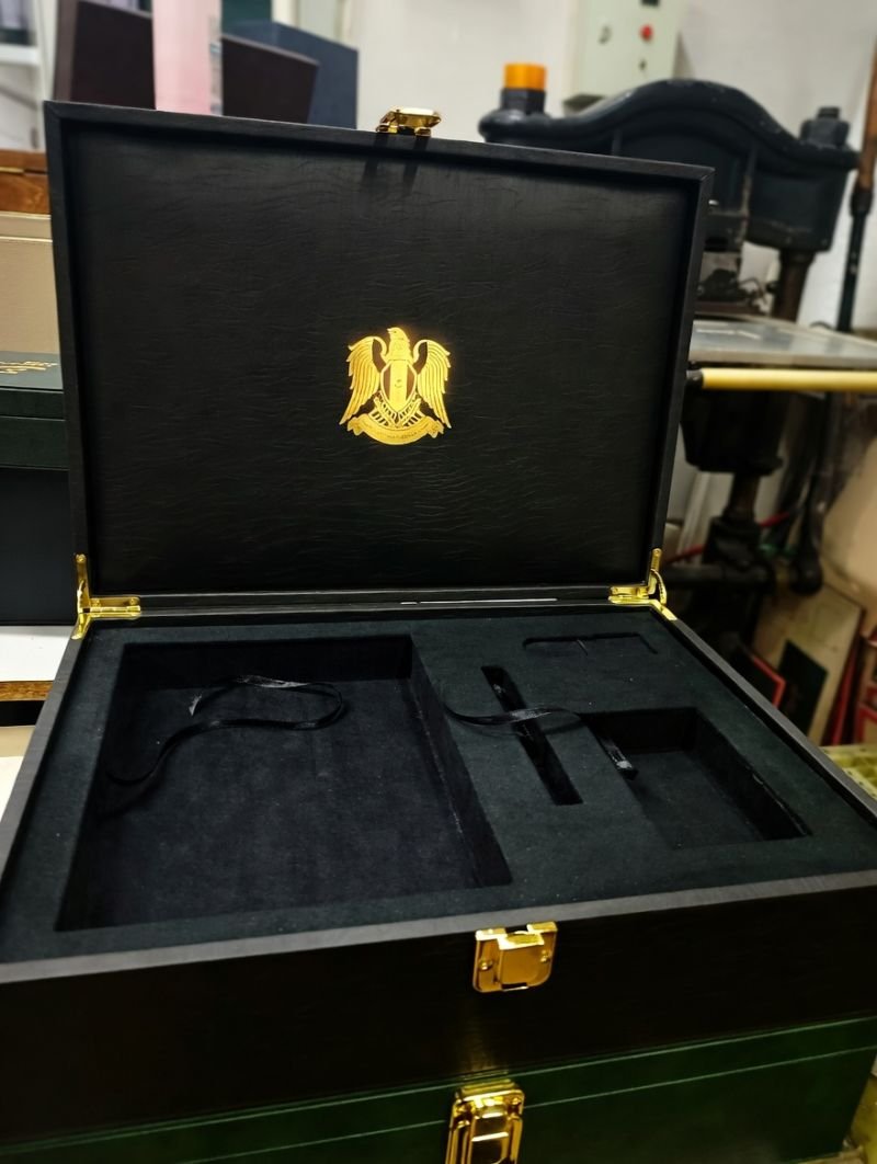 Black leather protocol presentation case with gold emblem